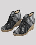 Pair of houndstooth patterned wedge shoes 