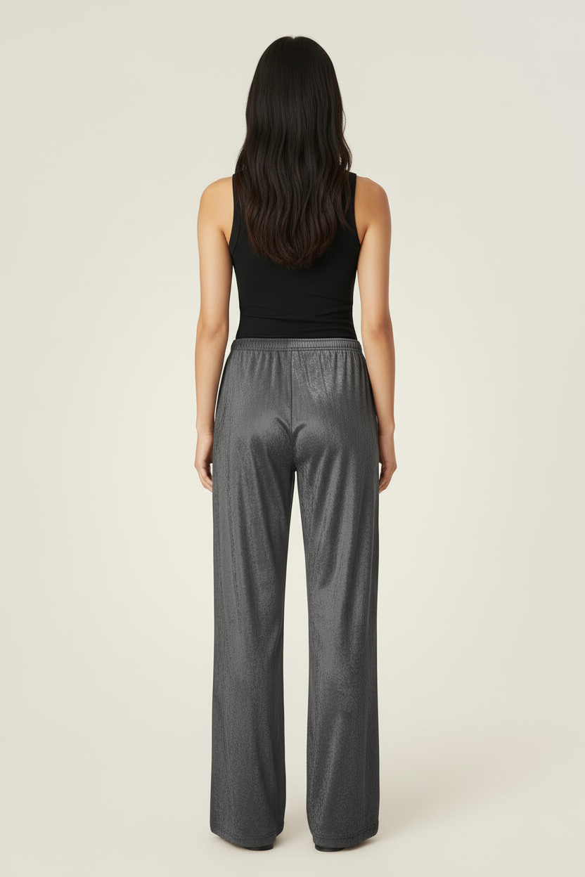 Back view of a model wearing NIMIAN Grey Diamond wide-leg trousers in crushed velour