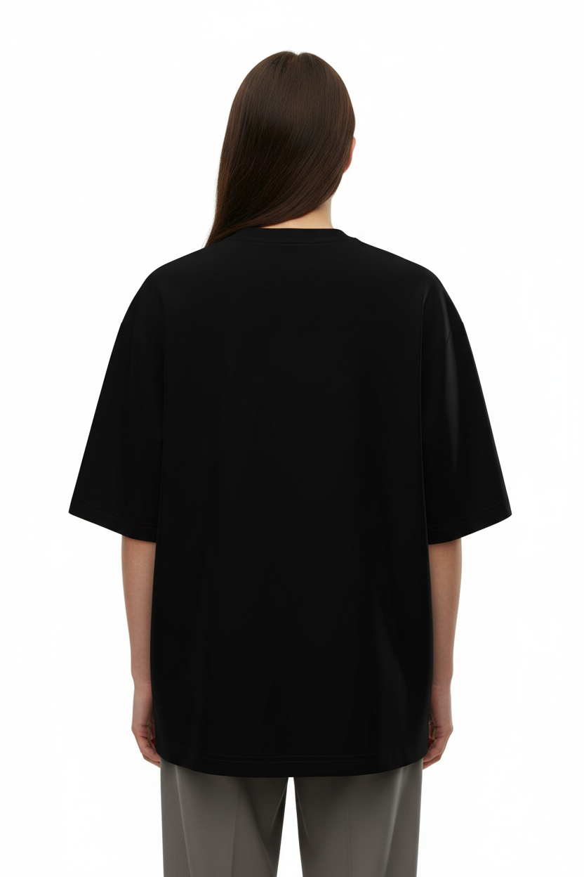 Back view of a model wearing the NIMIAN Angelus Noctis Oversized T-Shirt
