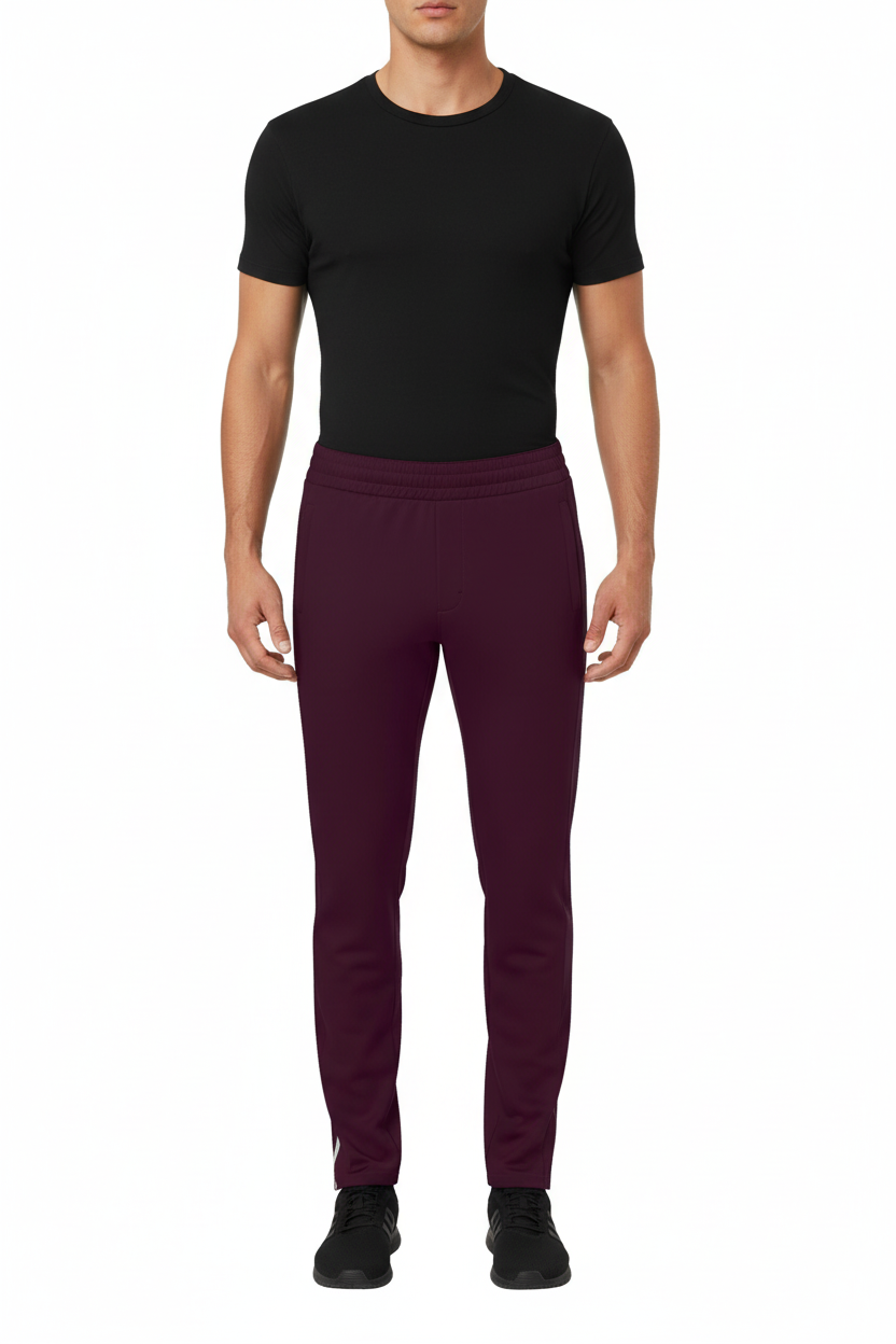 Front view of male model wearing NIMIAN Men's Track Trousers in Dark Grape