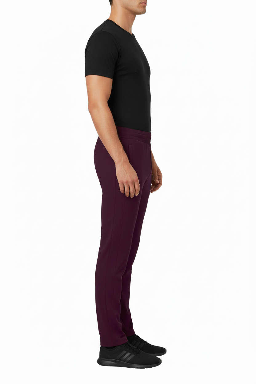 Side view of NIMIAN Men's Track Trousers in Dark Grape with a smooth pocket-free profile