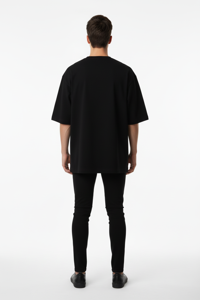 Back view of a model wearing the NIMIAN Regalis Seraphim Oversized T-Shirt