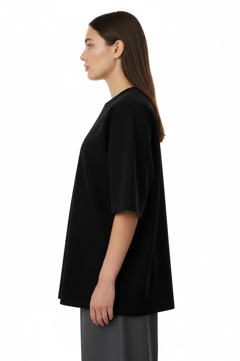 Side view of a model wearing the NIMIAN Angelus Noctis Oversized T-Shirt