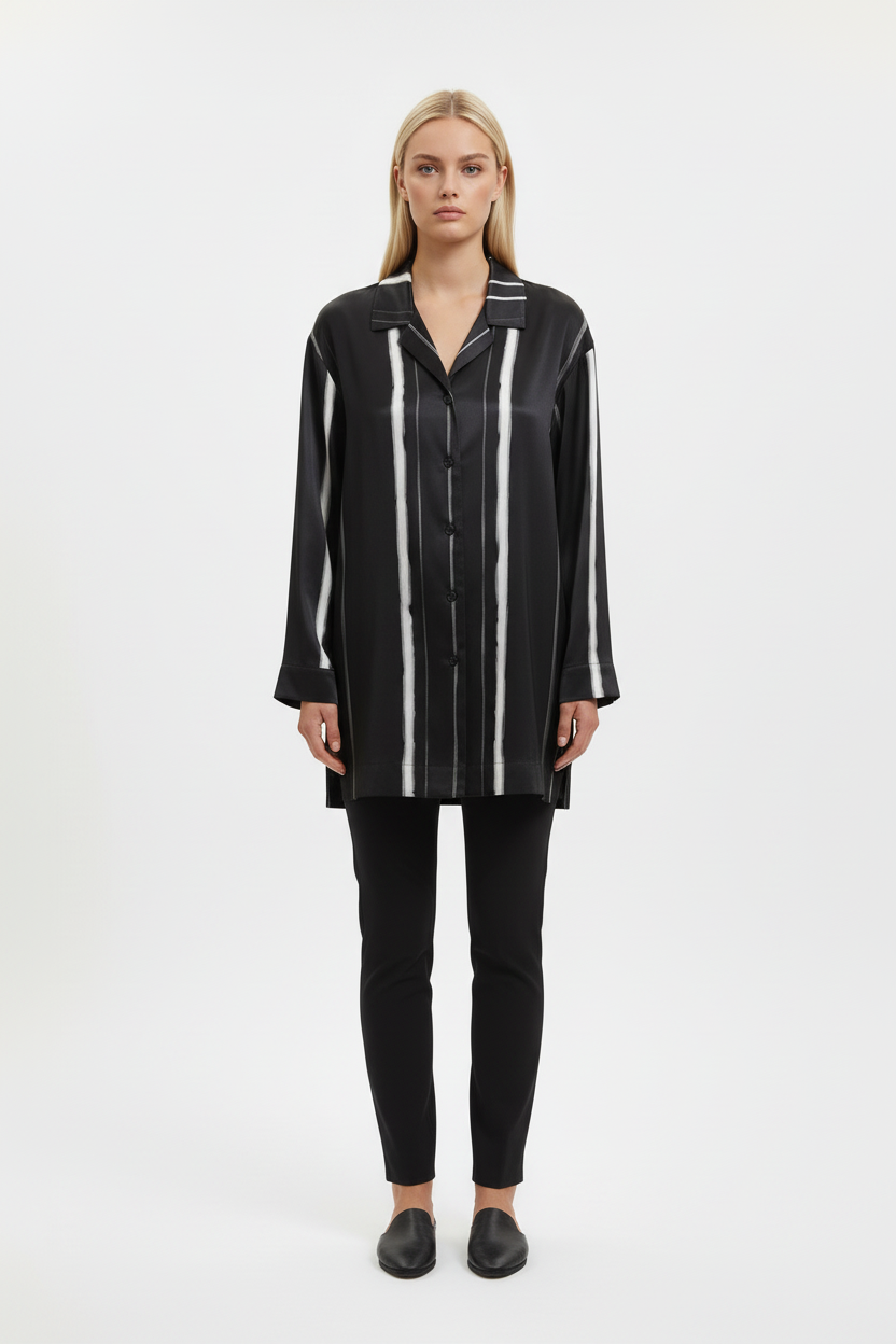 Front view of a model wearing the NIMIAN Nocturna striped silk pyjama shirt